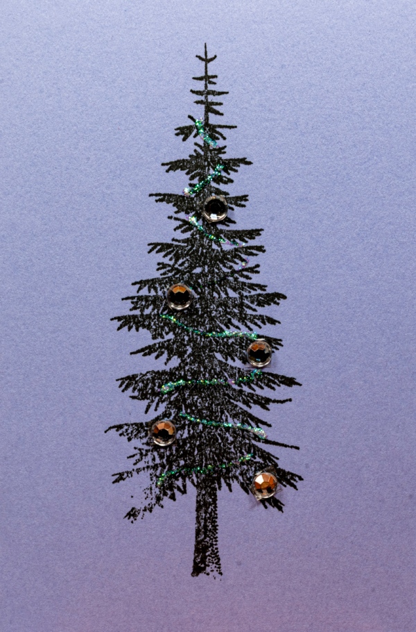 Handmade greeting card featuring a black pine tree decorated with silver gems and glitter by Pickle Paper.