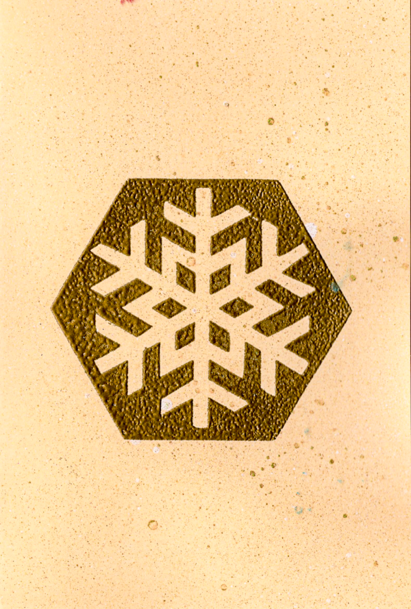 Handmade premium cardstock greeting card with bronze embossed snowflake design by Pickle Paper.